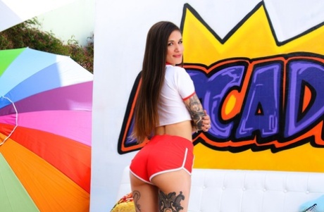 Tattooed girl Luna Lovely flaunts her big butt on her knees by stripper pole 89233768