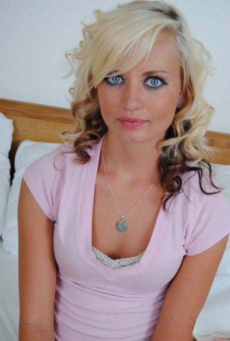 Blue-eyed blonde teen Codie Sweets undresses on a bed for her first nude poses 81643697