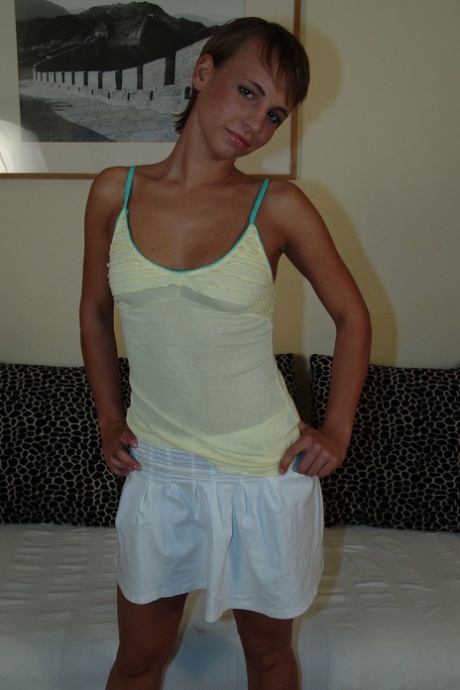 Solo girl with short hair grabs her bare ass before fisting her pussy 58744003