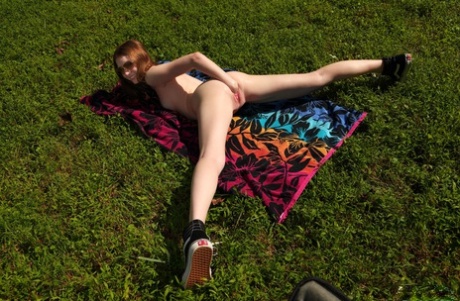 Young looking girl Myra Glasford dildos her pink pussy outside her tent 24454562