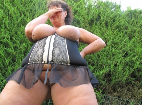 Mature fatties participate in group sex in a backyard location 98147631