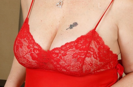 Chubby mature woman Brandie Sweet removes red babydoll and heels to pose nude 77138373